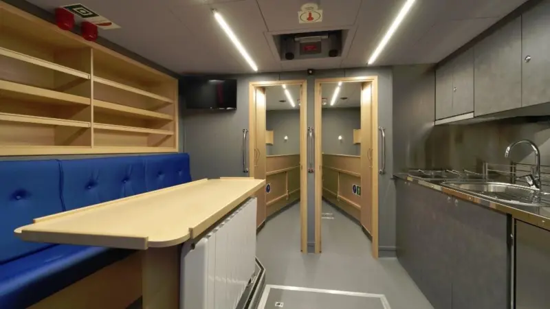 The vessel has a galley mess area with seating for four