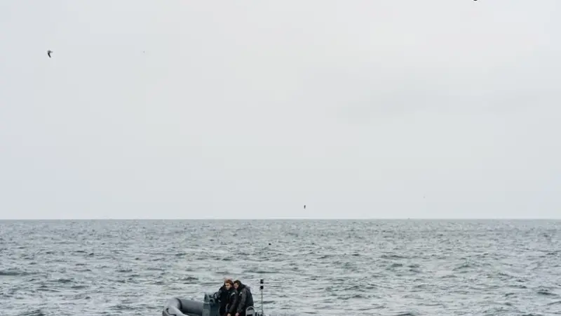 Delft Dynamics RH3 drone (RH-3 Swift), hovers above a fast rescue boat and casualty