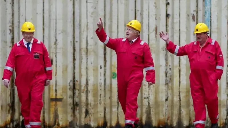 The Prime Minister, Boris Johnson Visiting Harland & Wolff (Appledore). L-R John Wood (Harland & Wolff Group CEO), Boris Johnson (Prime Minister), Clifford Edwards (Maintenance Manager)