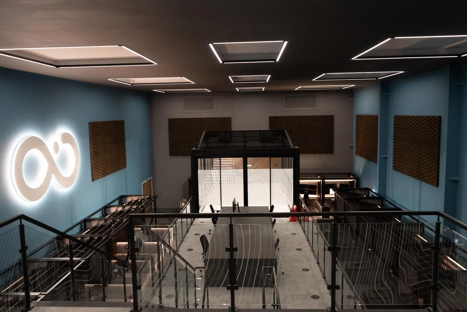 The Remote Control Centre (RCC) at Ocean Infinity - a large room with a central desk space, surrounded by several remote control pods against the walls