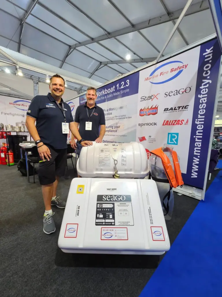 Members of Marine Fire Safety next to their new Seago life raft at Seawork 2023