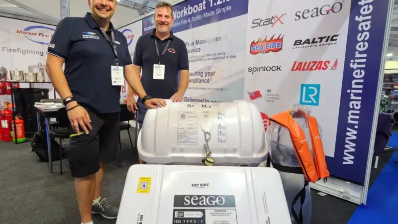 Members of Marine Fire Safety next to their new Seago life raft at Seawork 2023
