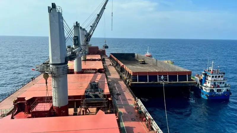 Part of the stranded vessel's cargo had to be transferred into a barge (Tsavliris)