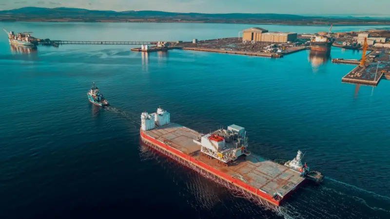 Barge 34 being towed to the Port of Cromarty
