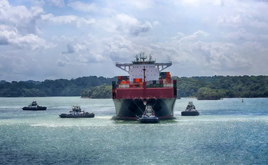 Container ship and tugs near the Panama Canal