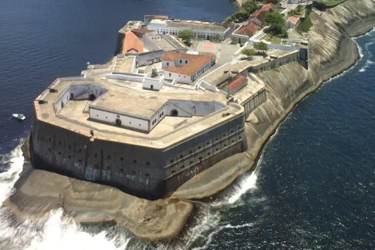 The image shows an overhead shot of the Santa Cruz Lighthouse, located on Santa Cruz Fortress at Guanabara Bay, Brazil