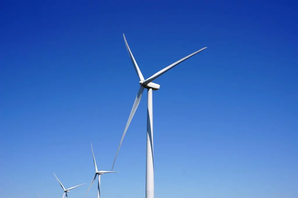 The image shows an up close picture of some offshore wind turbines