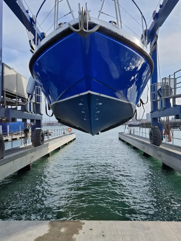 The gleaming new MV Lady Jean is lifted back into the water by the UK Docks Marine Services team ahead of her long journey from Gosport to Lake Victoria.