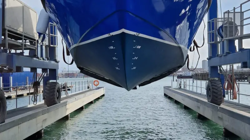 The gleaming new MV Lady Jean is lifted back into the water by the UK Docks Marine Services team ahead of her long journey from Gosport to Lake Victoria.
