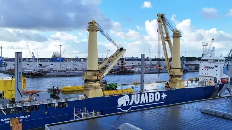 The image shows the two newly installed Econowind mechanical sails on Jumbo Jubilee