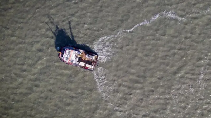 The picture shows an aerial shot of the Tiamat in action at Harwich Haven