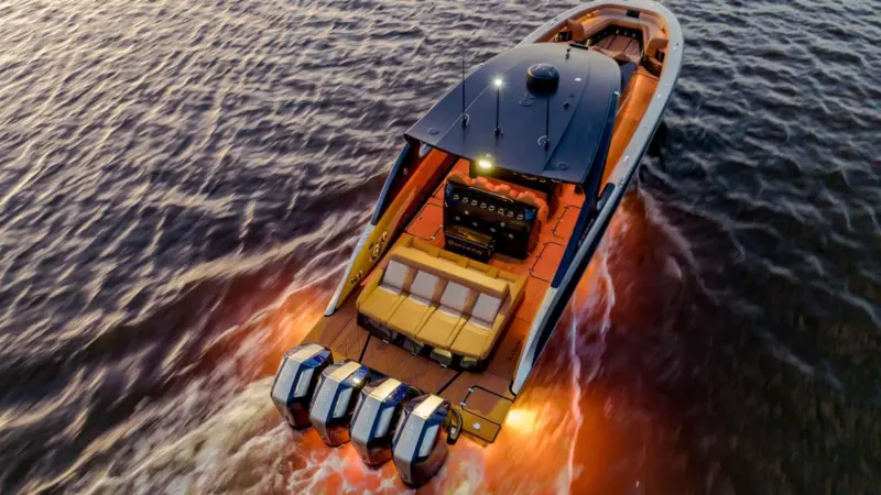 The image shows a luxury yacht equipped with Lumishore LED lighting