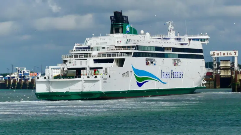The image shows a close up of an Irish Ferries ferry docked at Calais