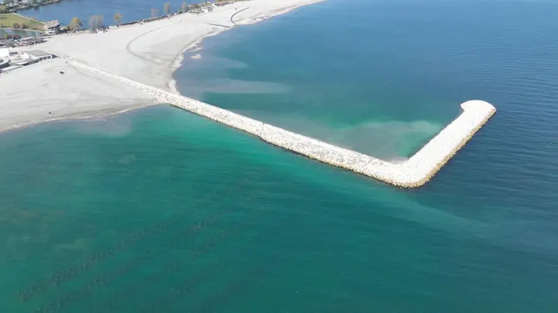 Breakwater jutting out into the sea at Jupiter-Neptun beach in Constanta, Romania