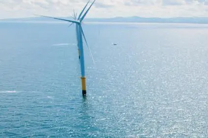 The image shows a wind turbine