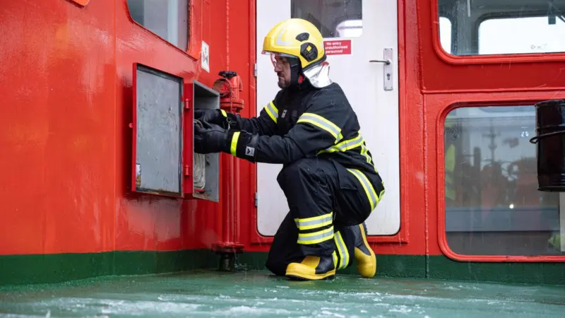 A firefighting suit in operation onboard a vessel