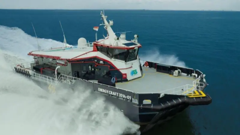 the image shows an AIRCAT vessel cutting through the waves on the water