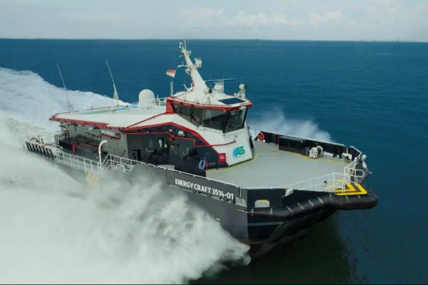 the image shows an AIRCAT vessel cutting through the waves on the water