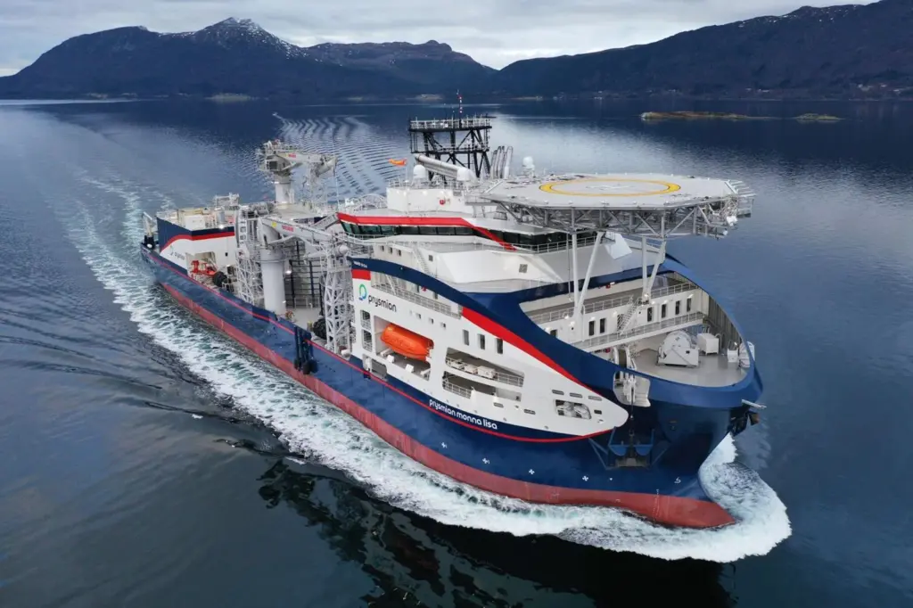The image shows the cable-laying vessel Prysmian Monna Lisa on the water