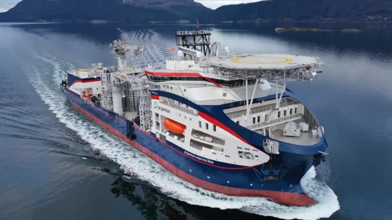 The image shows the cable-laying vessel Prysmian Monna Lisa on the water