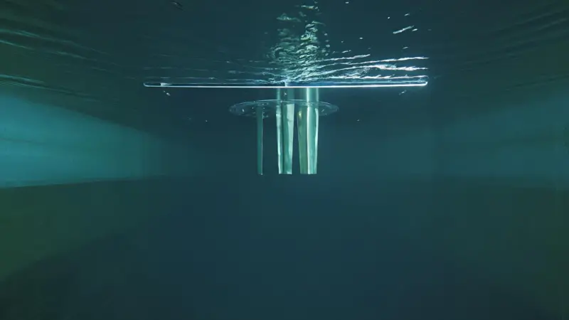 The image shows a picture of the ABB Dynafin in action under the water