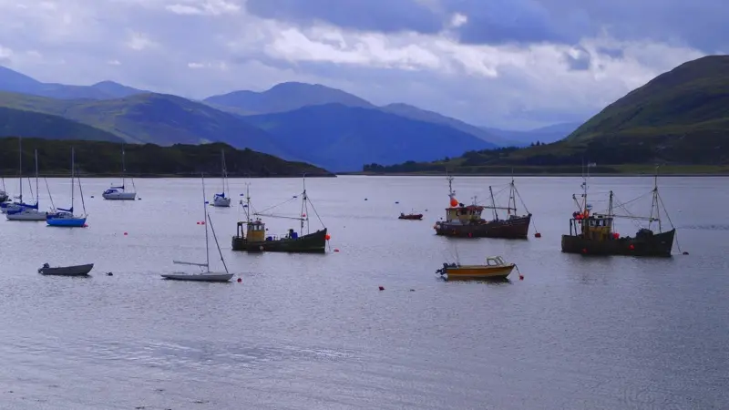 The image shows various vessels dotted around in the waters of the Isle of Skye