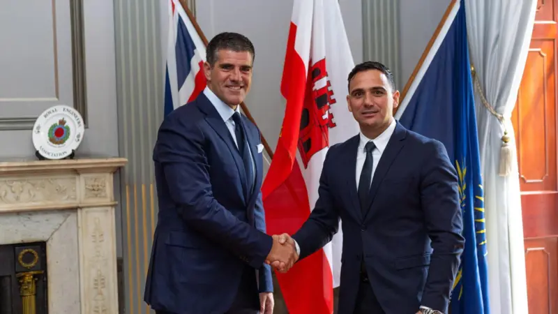 The photo shows John A. Bassadone, founder and CEO of Peninsula, with Aaron Lopez, head of the Maritime Academy University of Gibraltar.