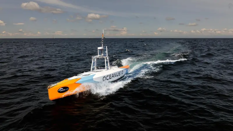 The image shows the Oceanus 12 XLR USV on the water