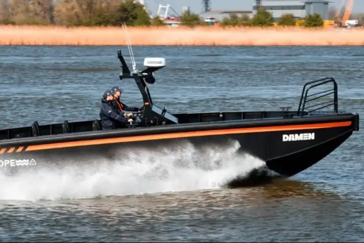 The image shows an HDPE workboat on the water