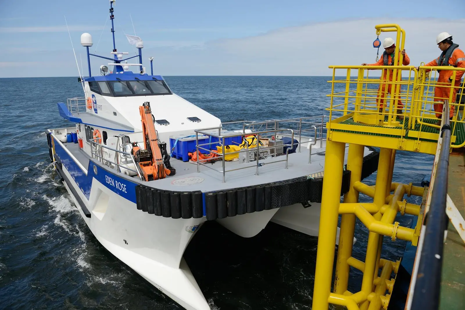 Docked CTV unloading and picking up engineers and equipment