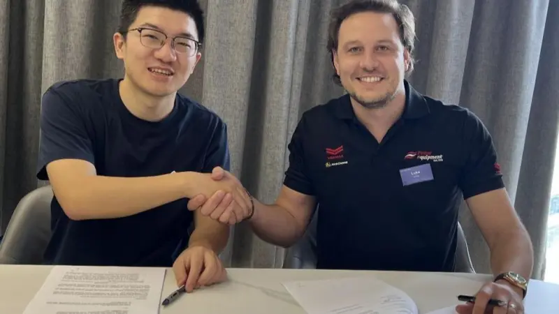 Danny Tao (L) and Luke Foster strike a strategic partnership