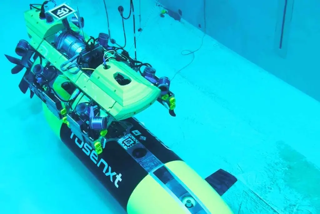 The image shows a Rosenxt AUV under water