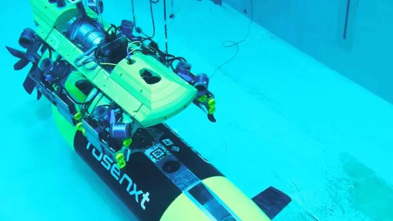 The image shows a Rosenxt AUV under water