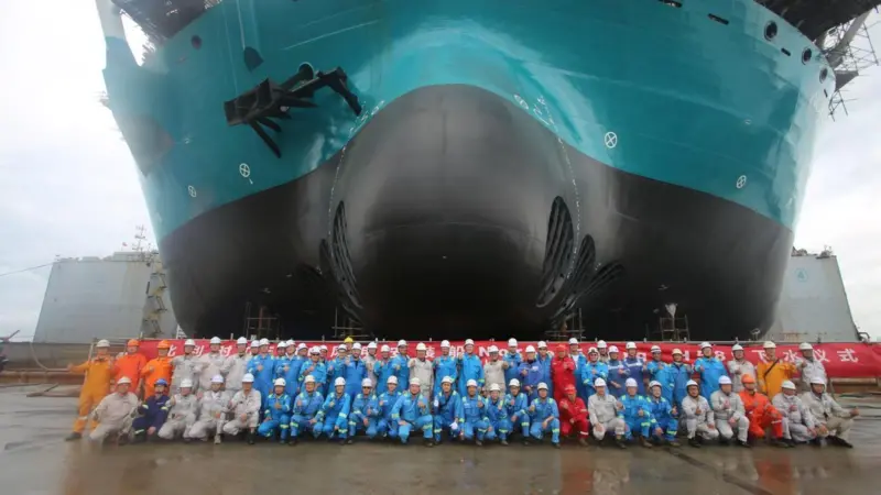 The image shows the build crew in from of the newly launched Norse Energi at the yard