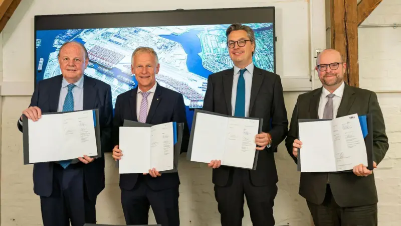Four members of the HPA showcasing an expansion agreement for Waltershofer Haven