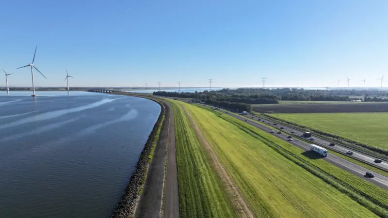 The image shows a drone photo of the foreshore at Lake Ijsselmeer
