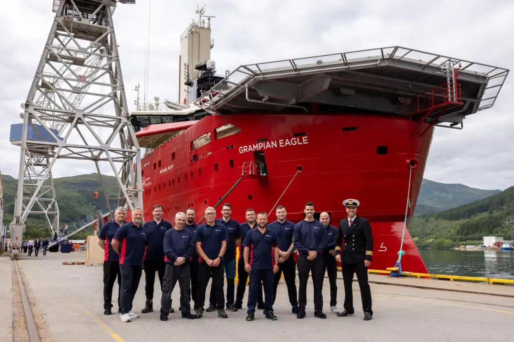 The image shows the newly delivered Grampian Eagle with its crew at the quayside