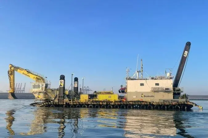 The image shows the Boskalis the backhoe dredger Manu Pekka at sea
