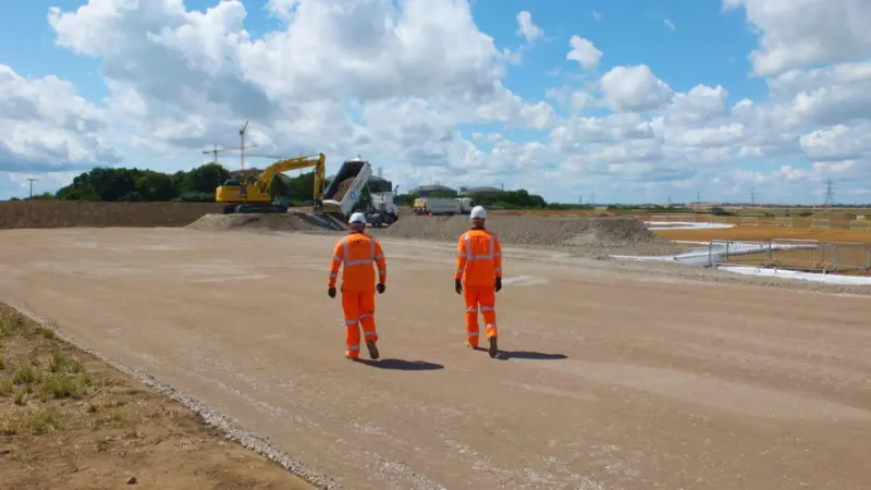 The image shows Jones Bros workers on site at the NeuConnect project