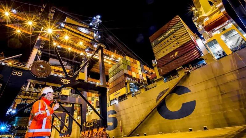 The image shows a container terminal on the quayside at Rotterdam