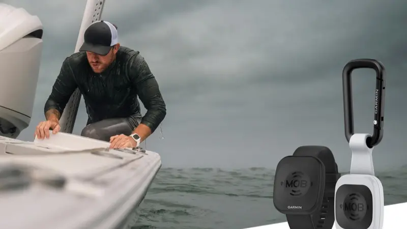 e image shows a man onboard a vessel with a cut out image of the Garmin Onboard