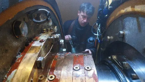 Hydrex diver or technician working inside flexible mobdock