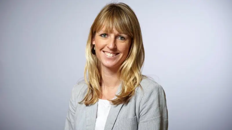 A photo of Olivia Powis, CCSA CEO, smiling for the camera