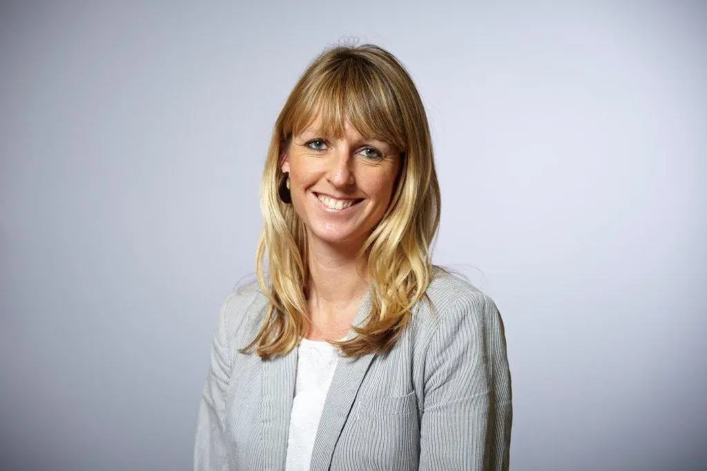 A photo of Olivia Powis, CCSA CEO, smiling for the camera