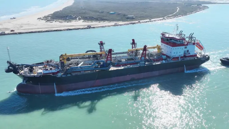 A picture of the Frederick Paup dredger on the water