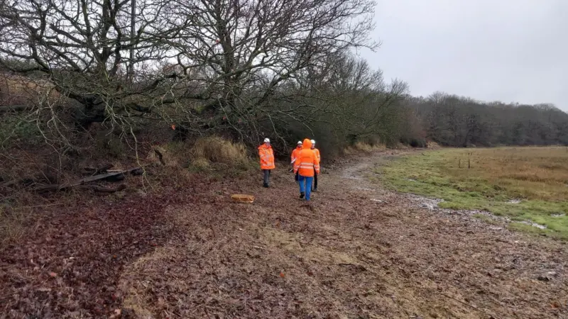 The image shows the BUDS project team on the foreshore of the Stour Estuary
