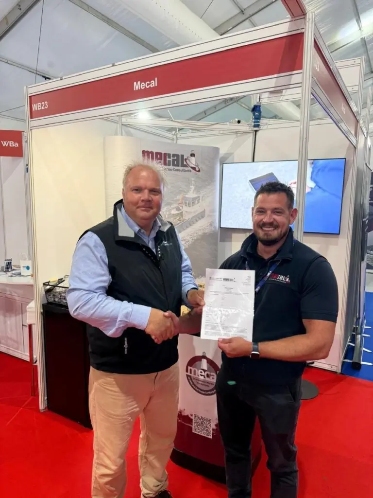 Zero USV Matthew Ratsey receives the certificate from Owen Preece, from MECAL