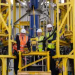 John Swinney, First Minister of Scotland alongside Derek Robertson, CEO at Subsea Micropiles and Reuben Aitken, Manager Director, Investment and International at Scottish Enterprise